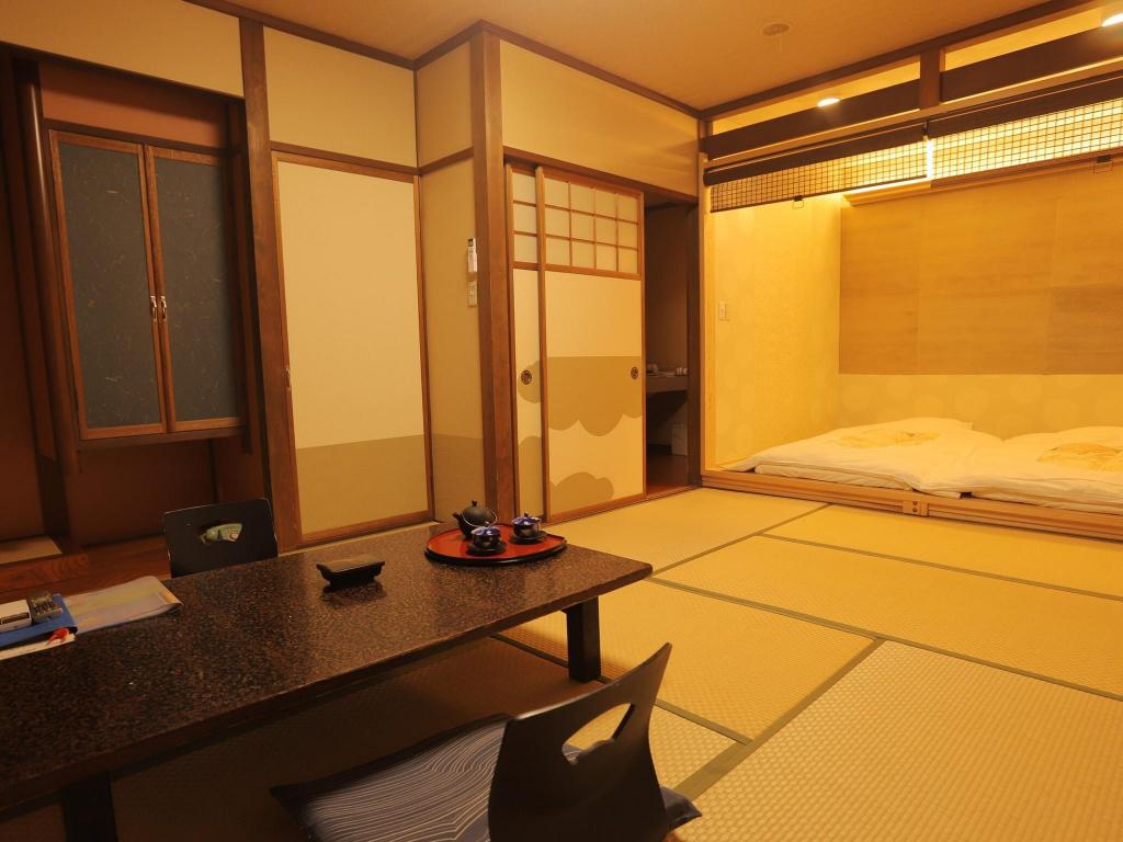 Beds or bedding in a real guestroom at Kaike Kaichoen