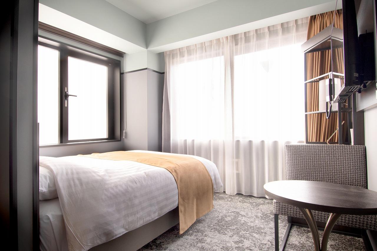 Kobe Plaza Hotel West supplier room and living-space example