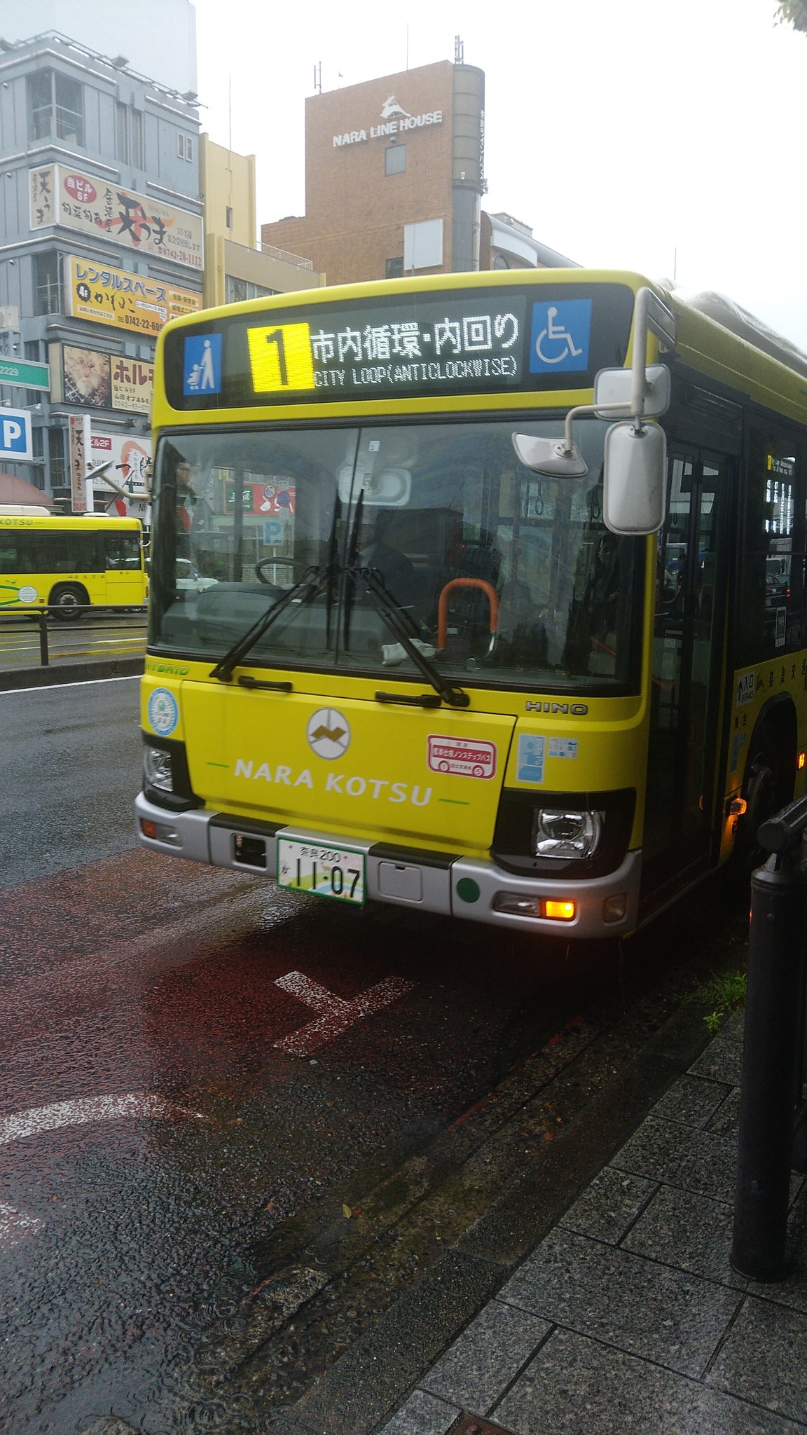 Yellow Nara Kotsu bus showing route 1 City Loop anticlockwise outside Kintetsu Nara Station