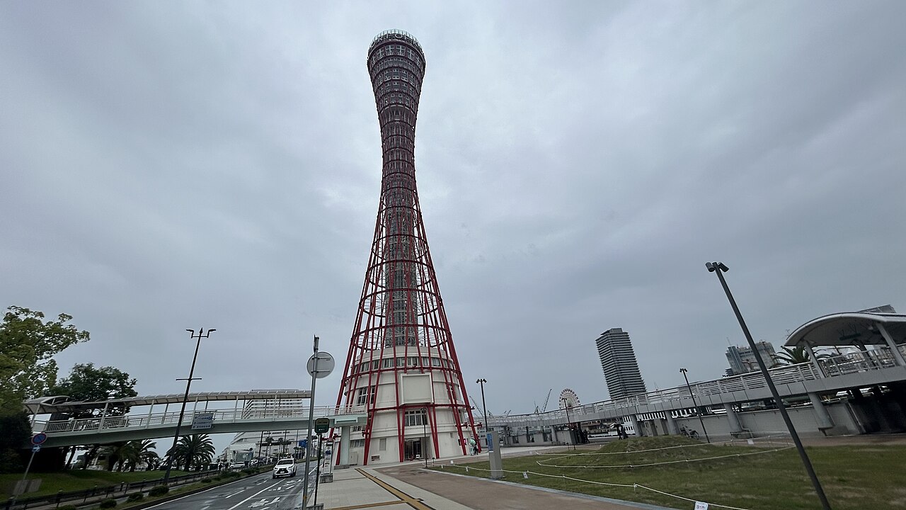 Red lattice exterior of Kobe Port Tower photographed in 2024
