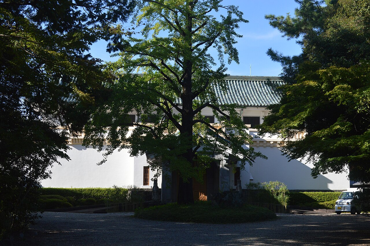 White walls and tiled roof of the Tokugawa Art Museum main building, partly behind trees