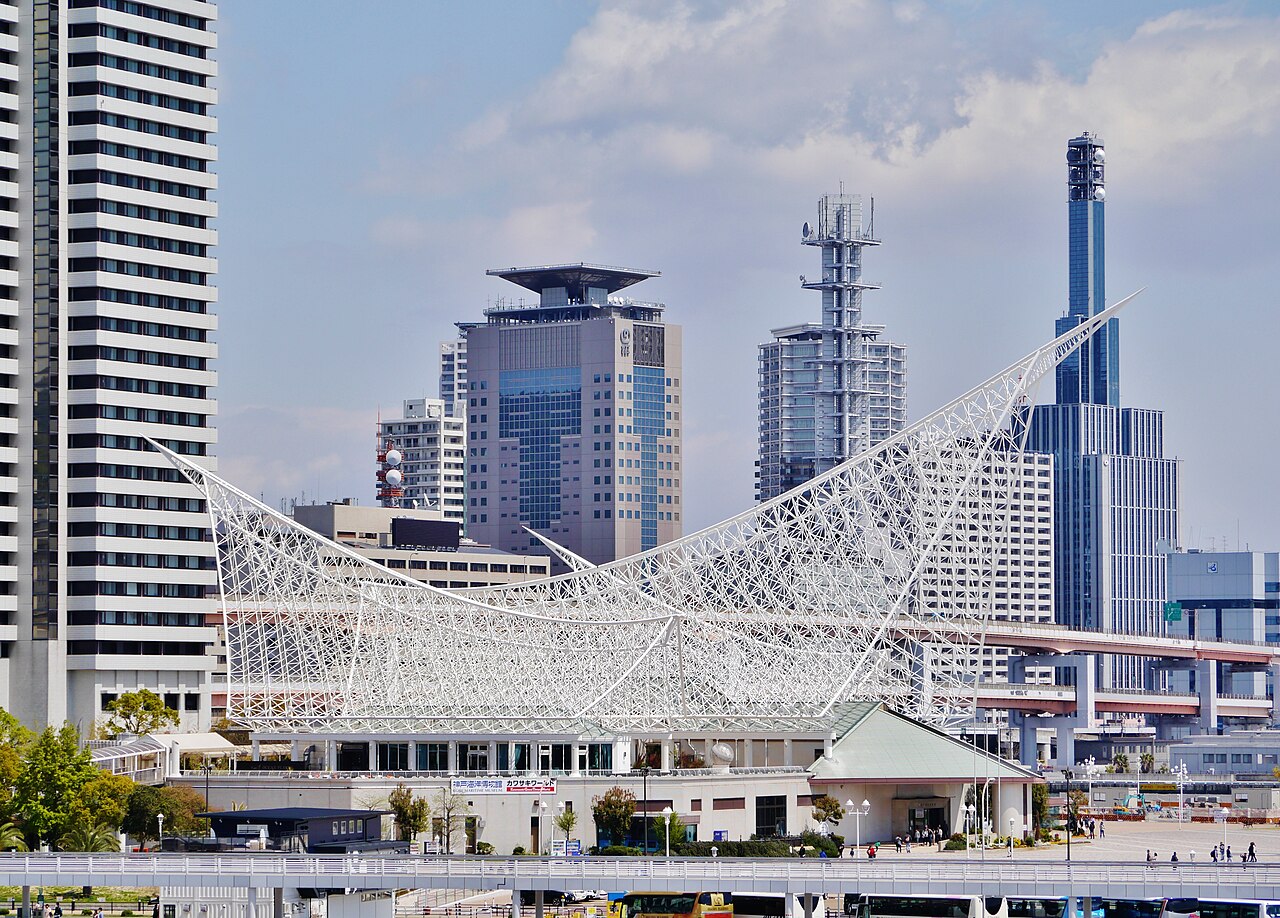 Kobe Maritime Museum exterior with a white sail-like lattice roof and Kawasaki World sign