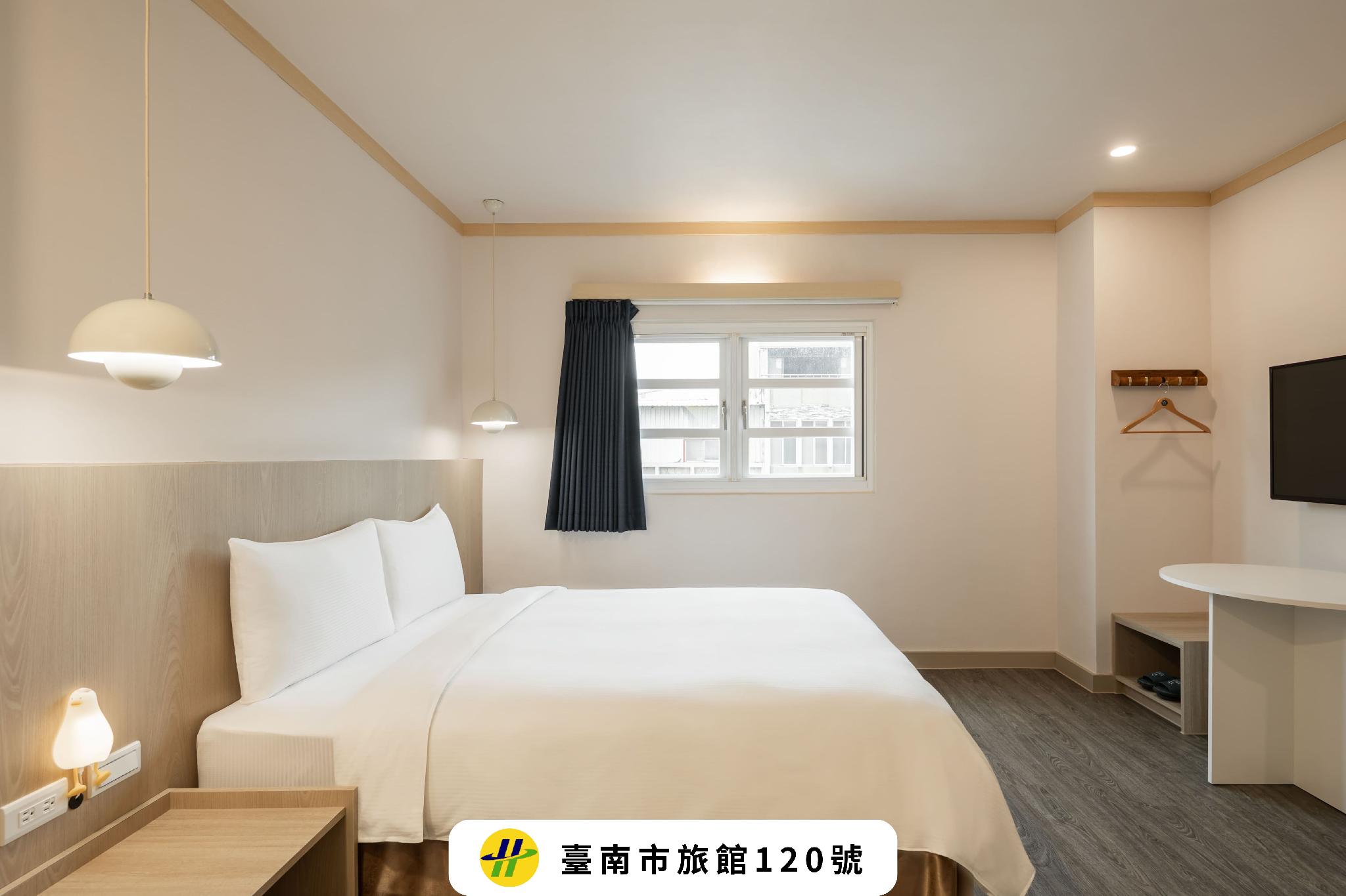 Kindness Hotel Tainan Minsheng: Guestroom with a white bed, window, TV and original registration graphic