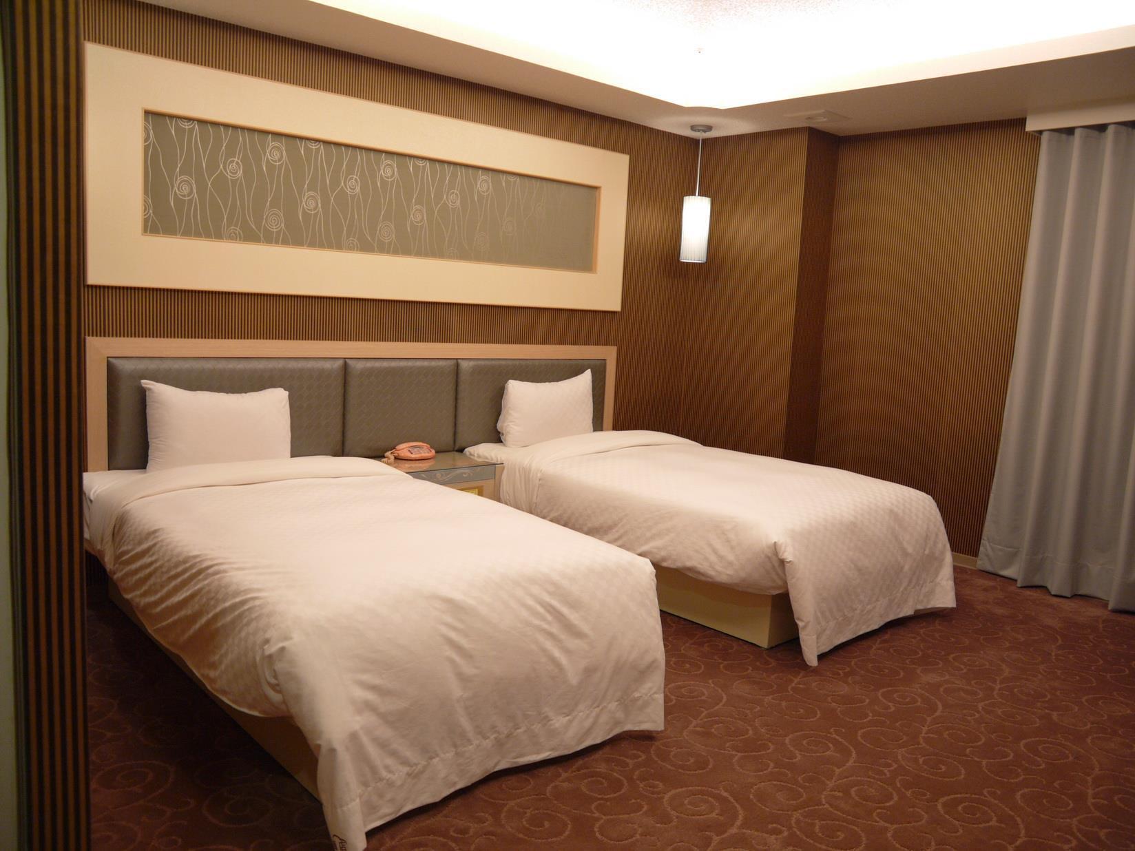 Beidoo Hotel / 北都大飯店: 침대와 실내 배치가 보이는 실제 객실 예시