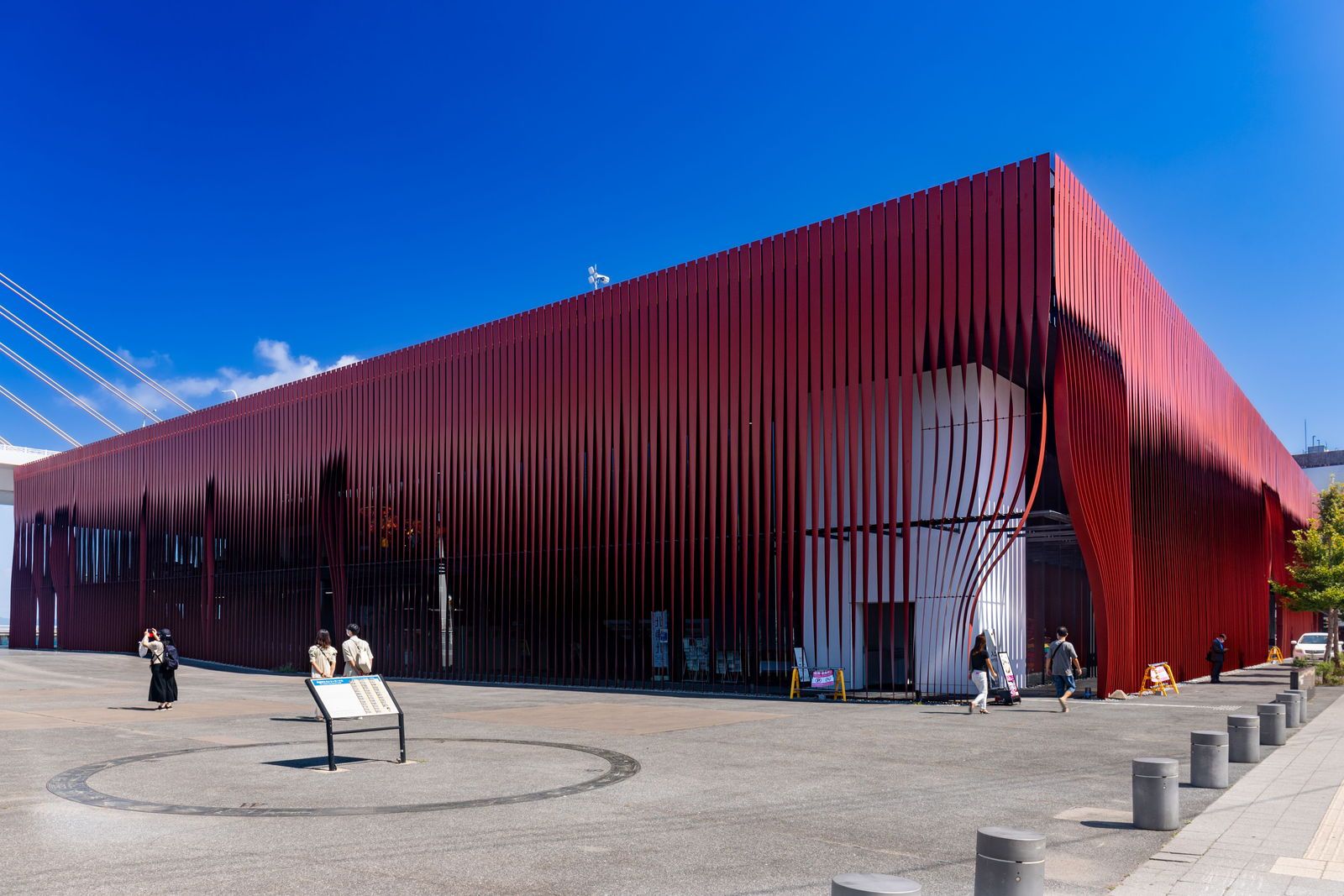 Red metal facade and forecourt of Wa Rasse in Aomori